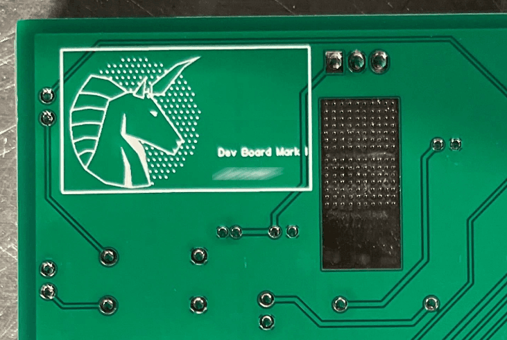 Green circuit board with white unicorn logo and "Dev Board Work" text, featuring electronic components and pathways.